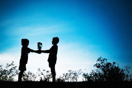 Girl-giving-boy-a-flower