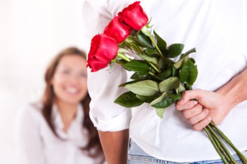 Man-Giving-Flowers-to-Woman